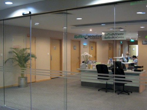 Reception and teak doors at Chikalthana Dental Clinic